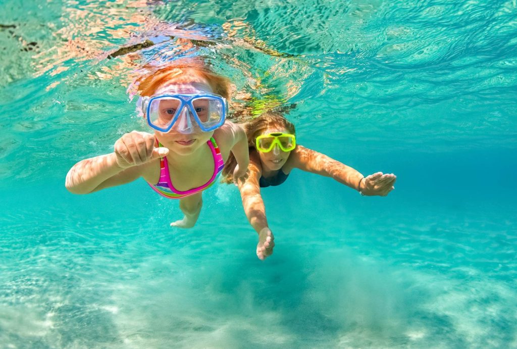Snorkelers-Kids-Visitors-Underwater-Ocean-Hawaii-shutterstock_582650464 Snorkelers Kids Visitors Underwater Ocean Hawaii shutterstock